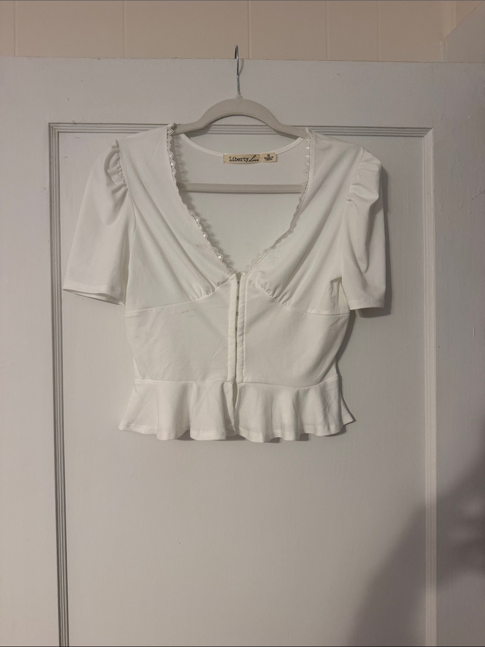 Liberty Love White Peplum V-Neck Crop Top with Lace Trim
